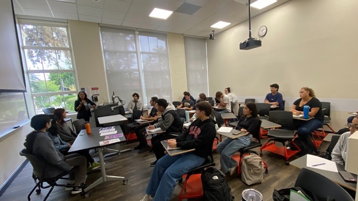 Instructor giving instructions to students in a classroom