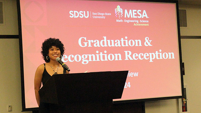 A speaker at the podium of the MESA graduation and recognition reception