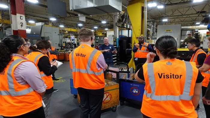 Group of engineering students in front of a manufacturing safety inspection check